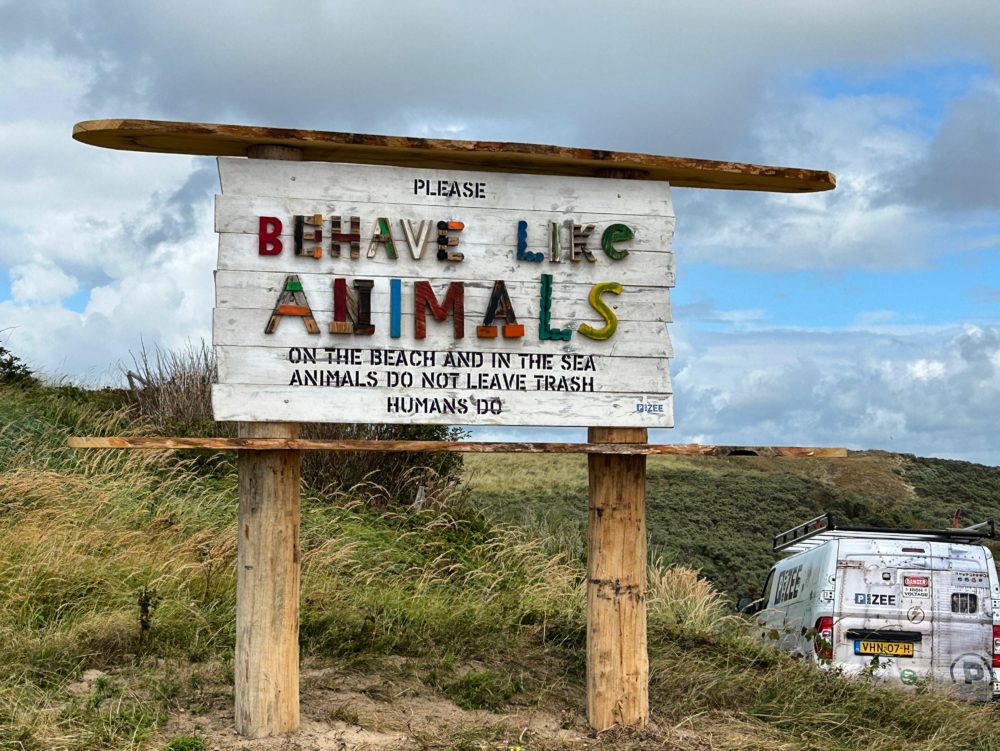 A Thought-Provoking Beach Sign in Castricum aan Zee, Netherlands