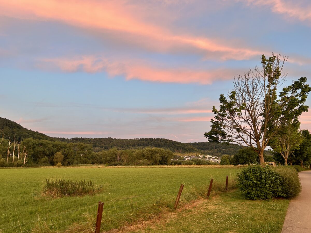 The Red Sky and the Fluffy Drama Above
