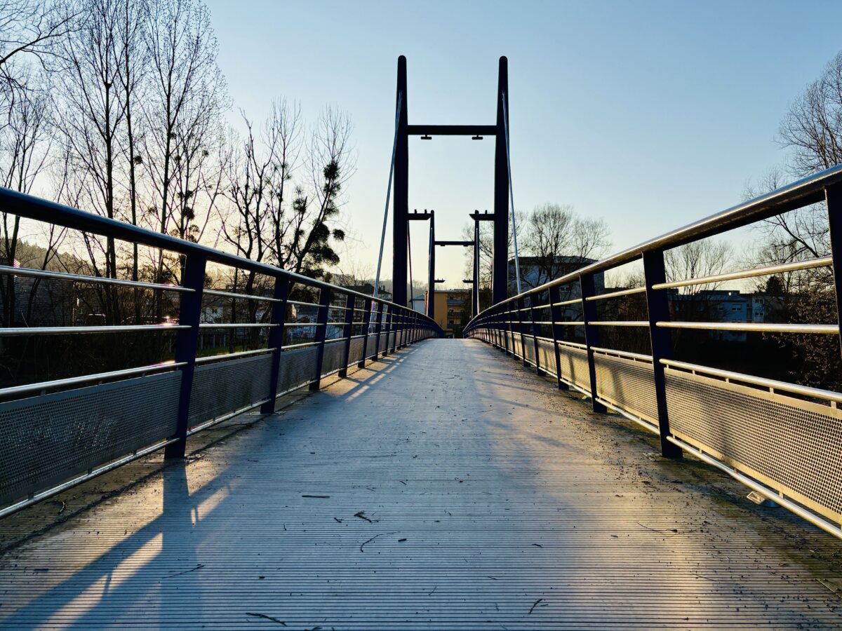 Spring sunset reflections on a blue bridge in Walferdange